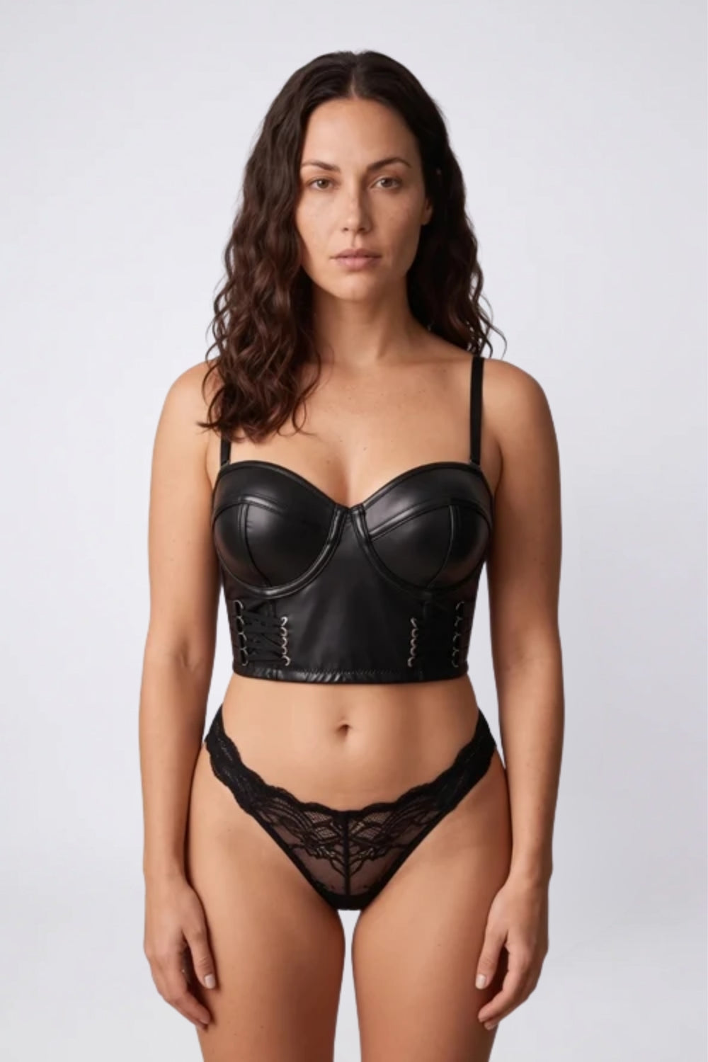 Model wearing lace-up grain effect bustier in black