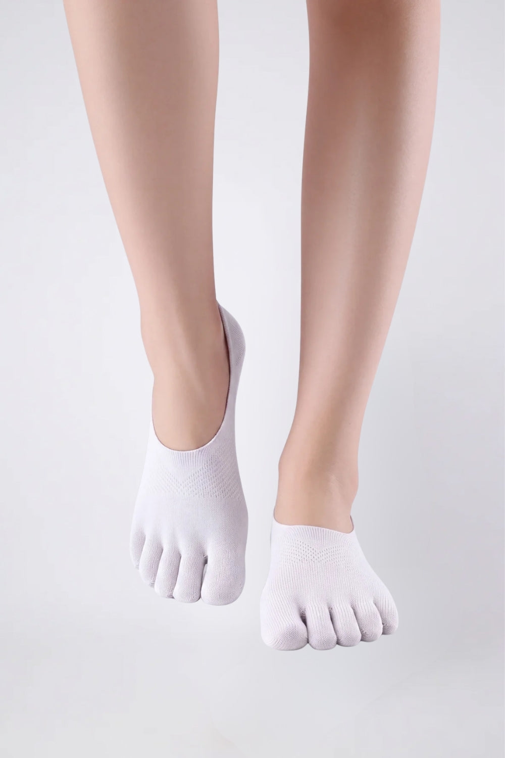 Model wearing five-toe no-show stockings in white