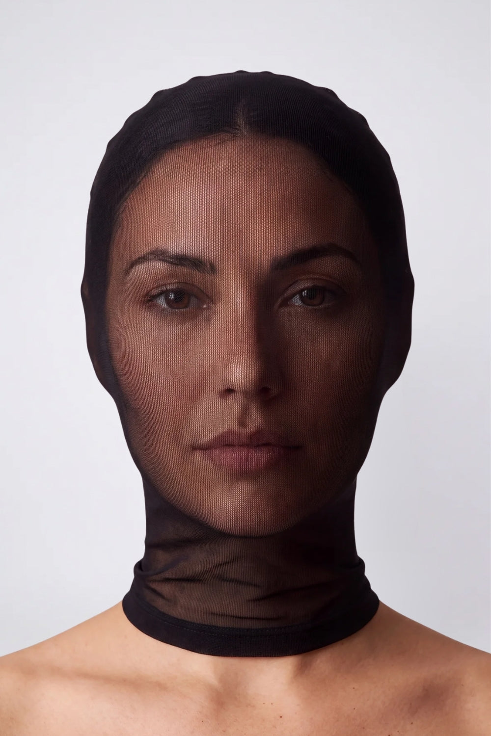 Model wearing sheer nylon full head stocking in black