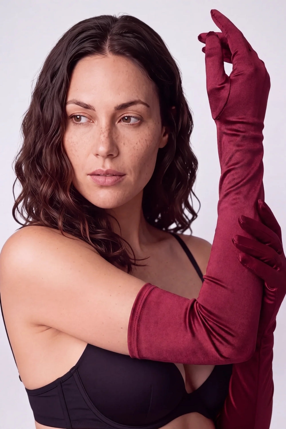 Model wearing silky opera length gloves in red