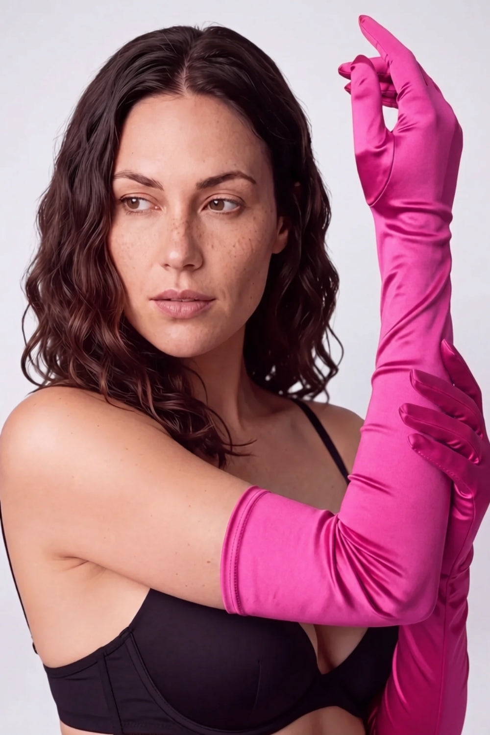 Model wearing silky opera length gloves in pink