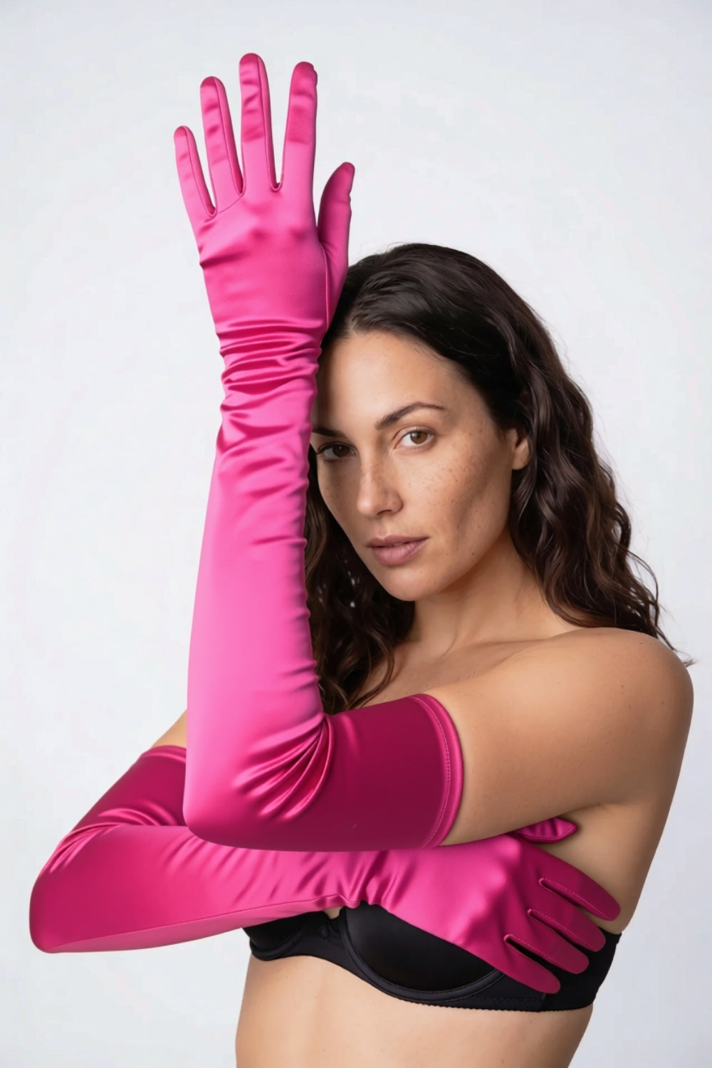 Model wearing silky opera length gloves in pink, alternate view