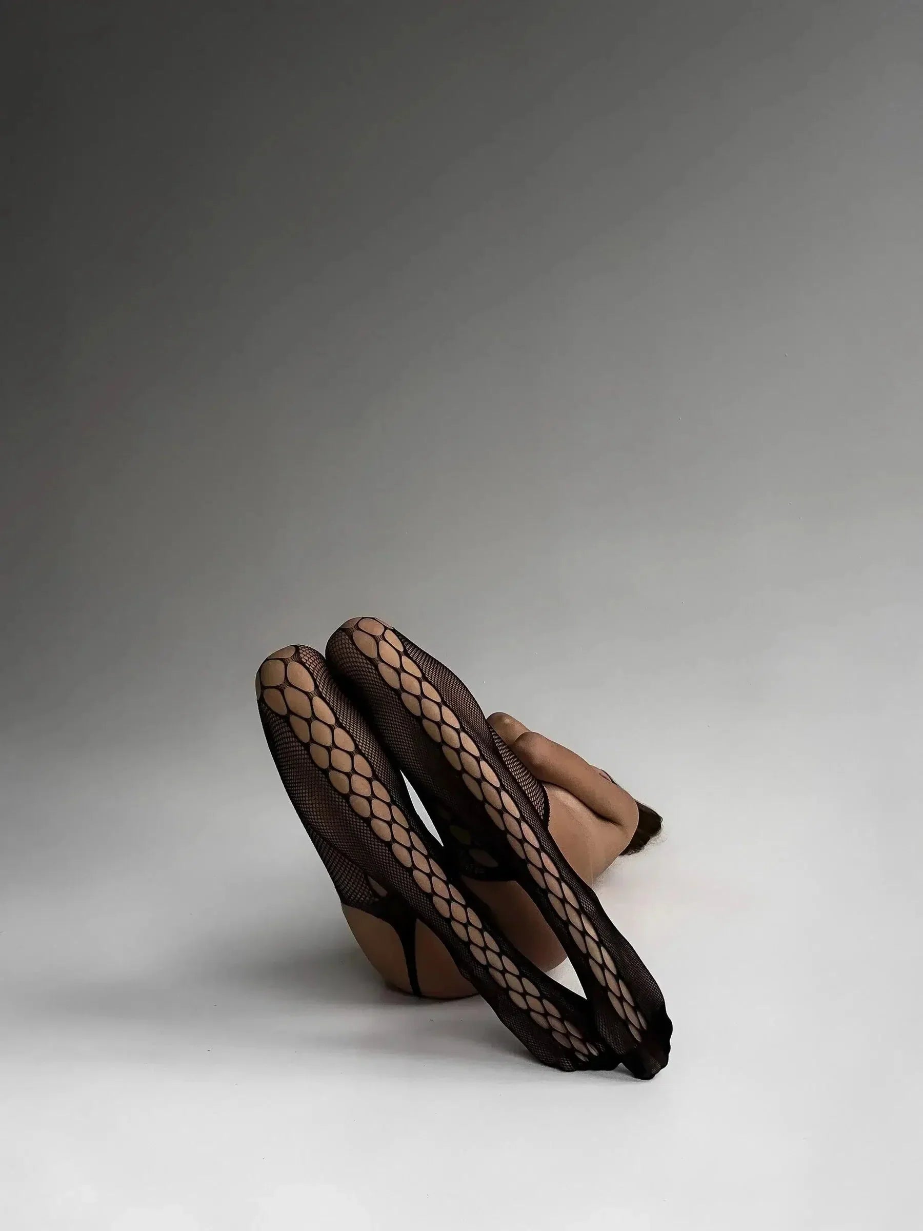 Fishnet garter illusion with side cutouts – Stockings