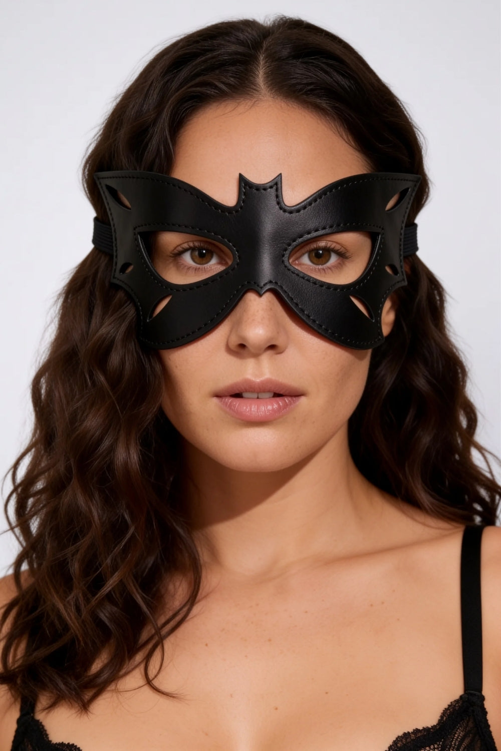 Model wearing bat wing grain finish eye mask in black