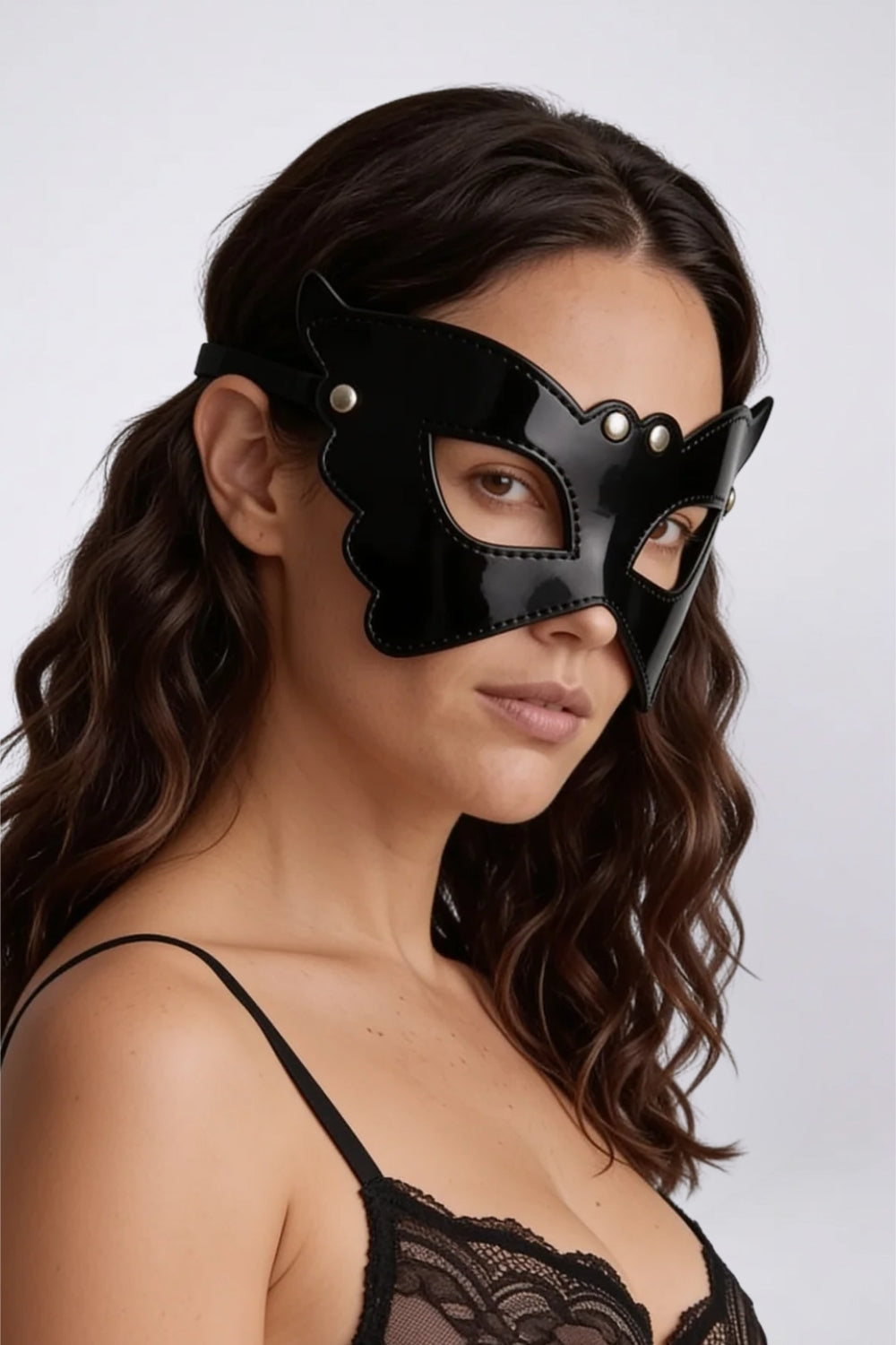 Model wearing butterfly wing grain finish eye mask in black, alternate view