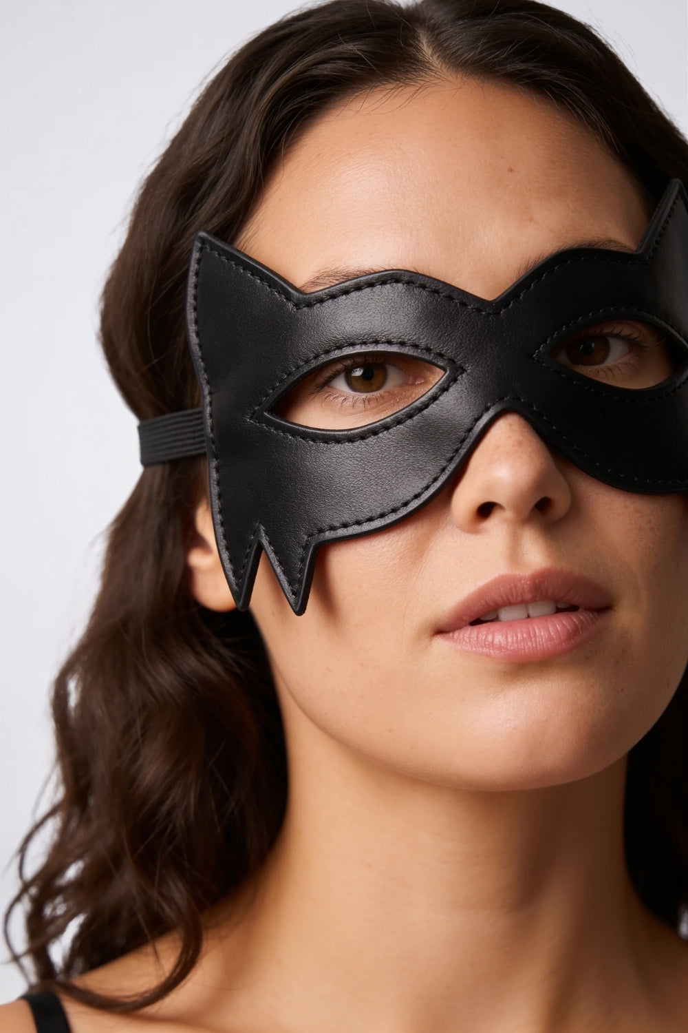 Model wearing cat ear grain finish eye mask in black, alternate view