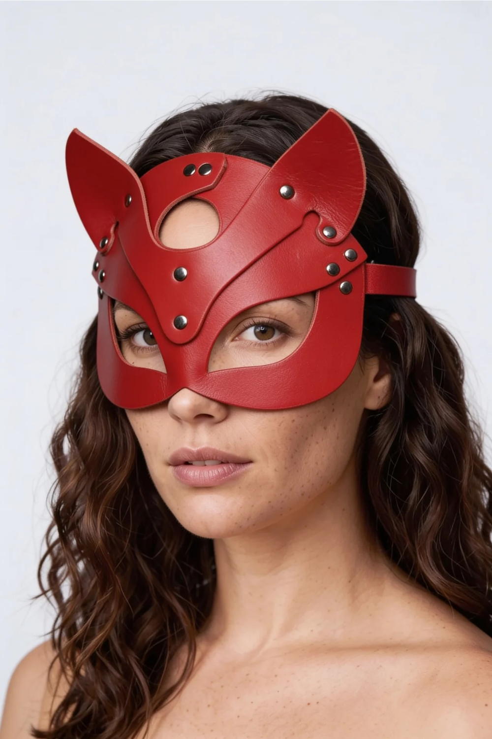 Model wearing leather cat ear design costume mask in red