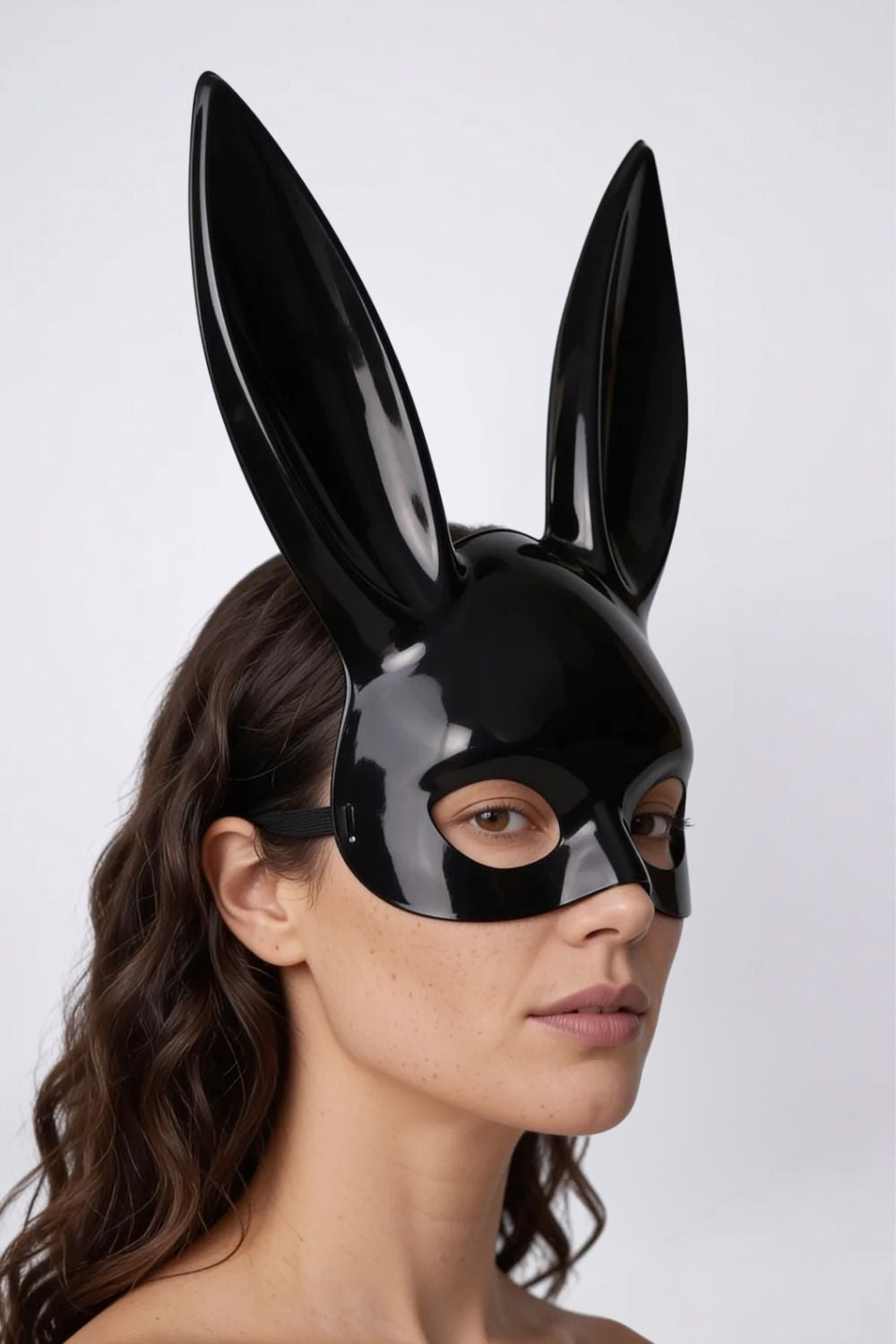 Model wearing long ear full-face costume mask in black, alternate view