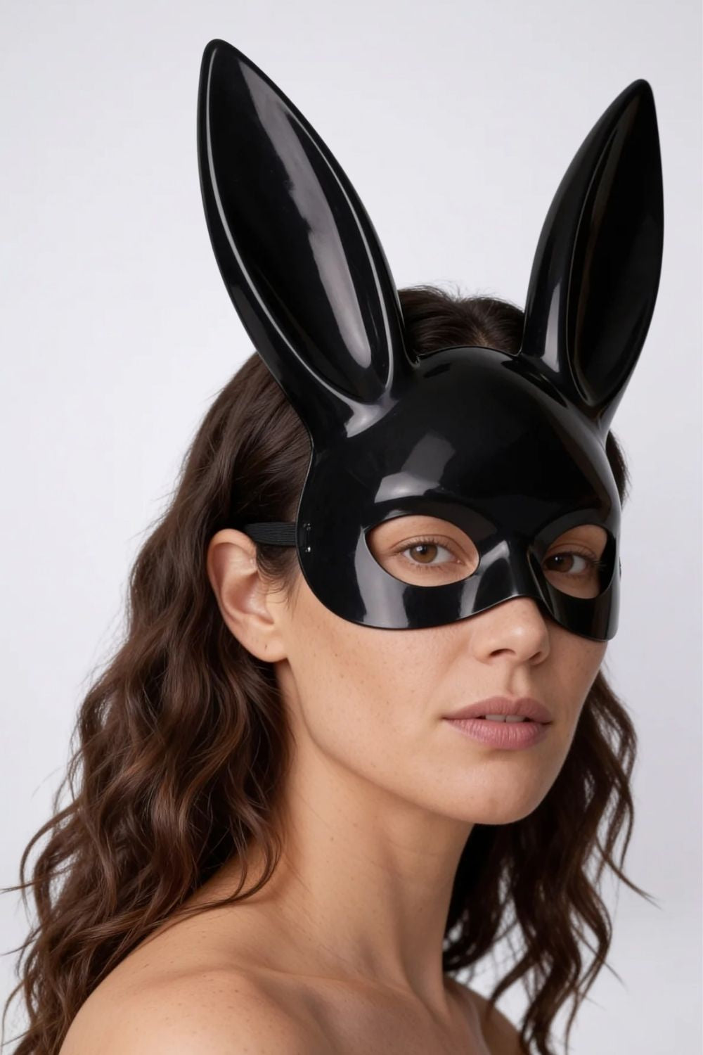 Model wearing long ear full-face costume mask in black, alternate view