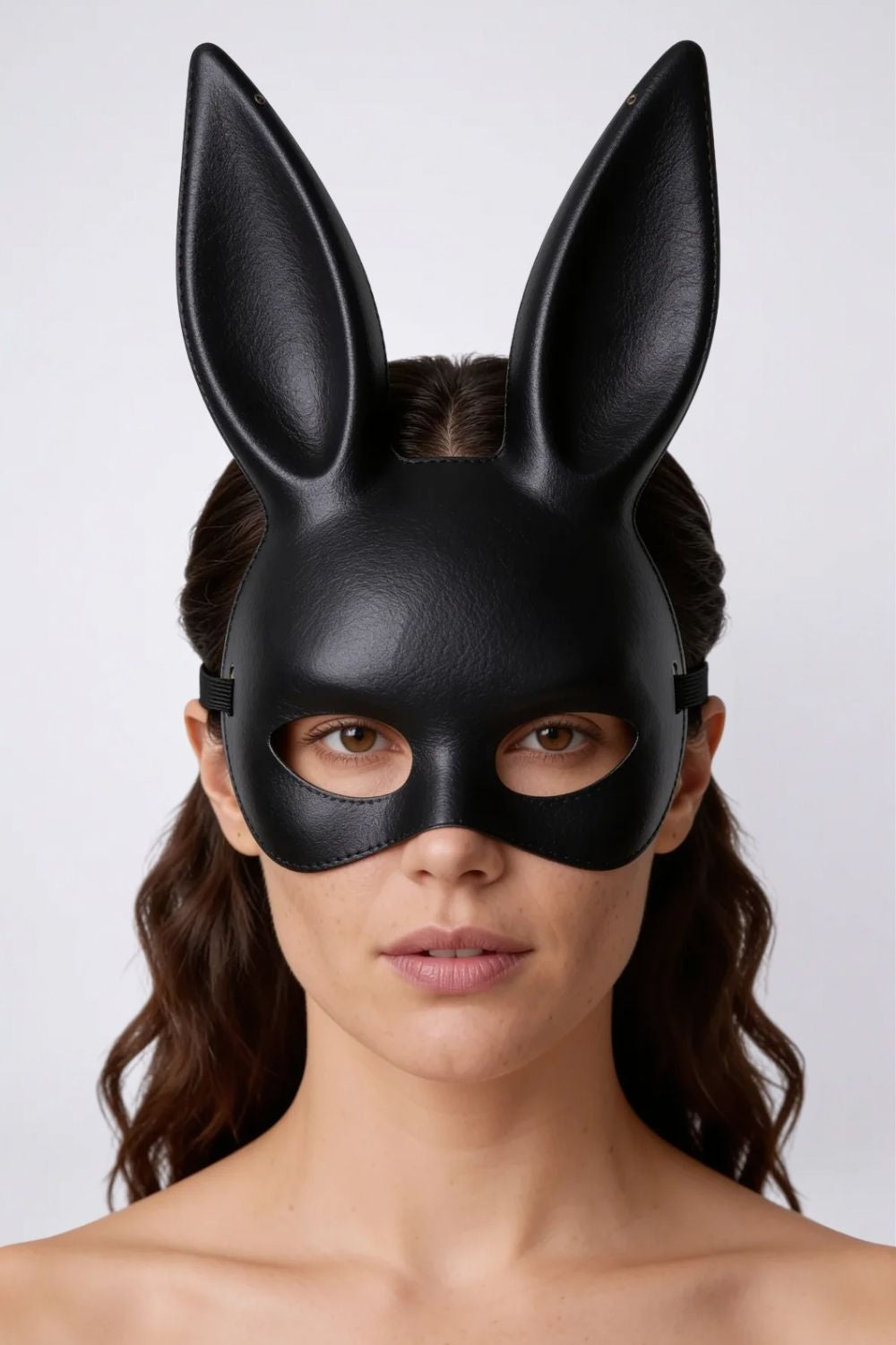 Model wearing long ear full-face costume mask in black, hard finish