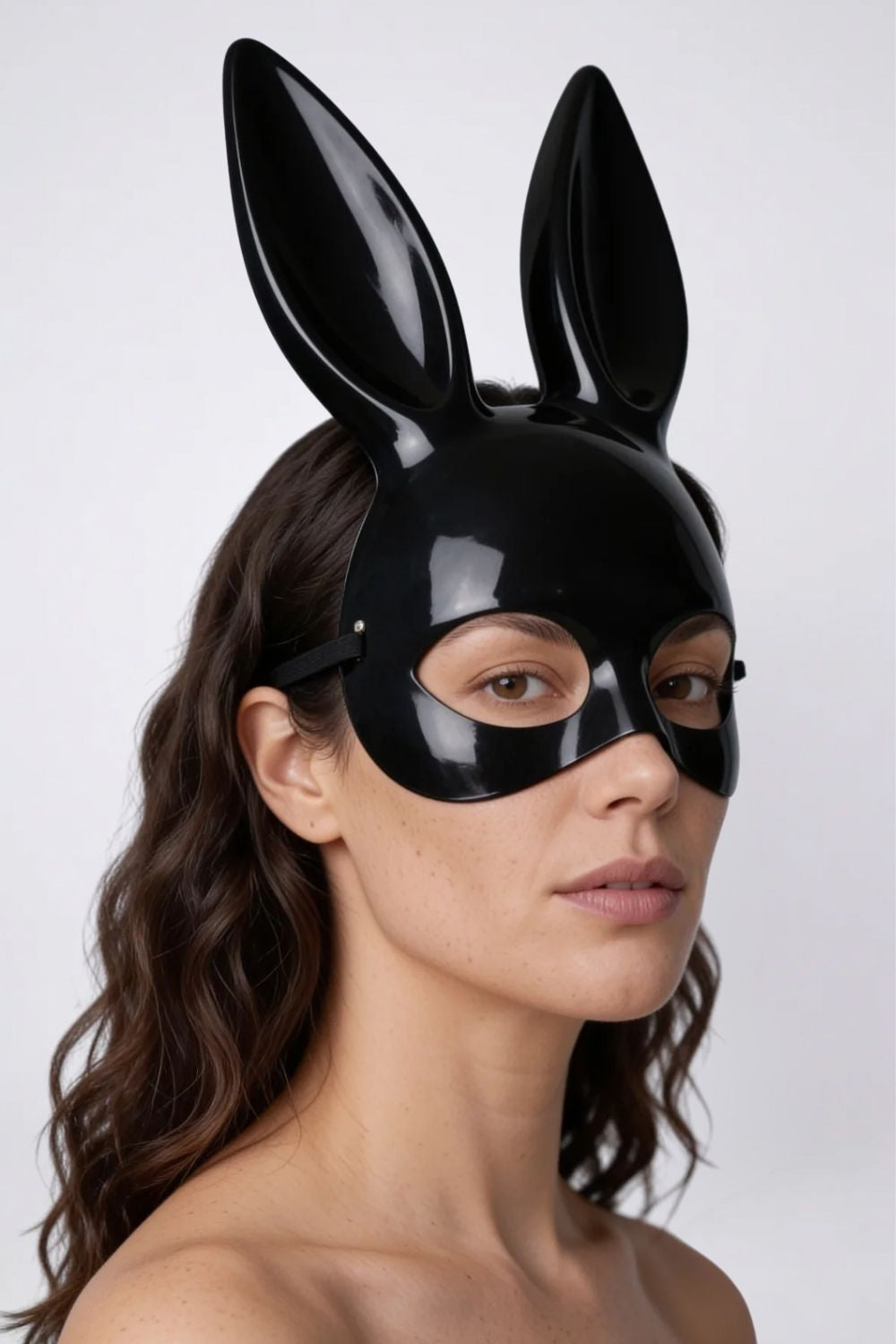 Model wearing long ear full-face costume mask in black, hard finish, alternate view
