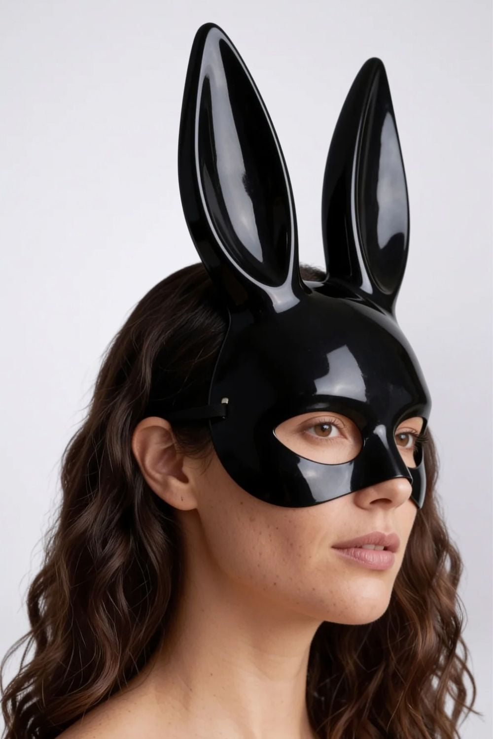 Model wearing long ear full-face costume mask in black, hard finish, alternate view