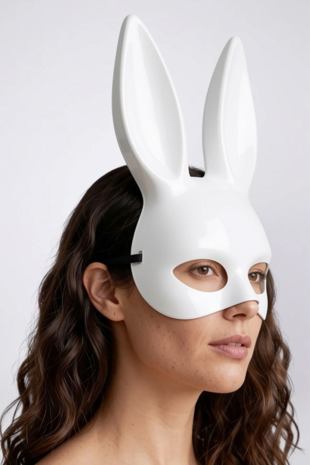Model wearing long ear full-face costume mask in white, hard finish, alternate view