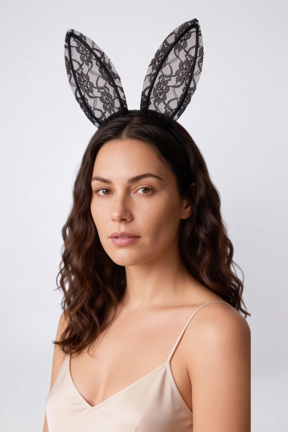 Model wearing sheer floral lace bunny ears headwear in black