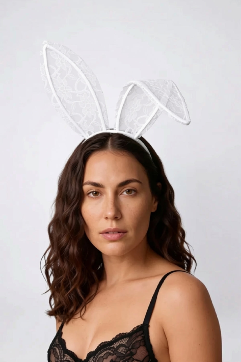 Model wearing sheer floral lace bunny ears headwear in white, alternate view