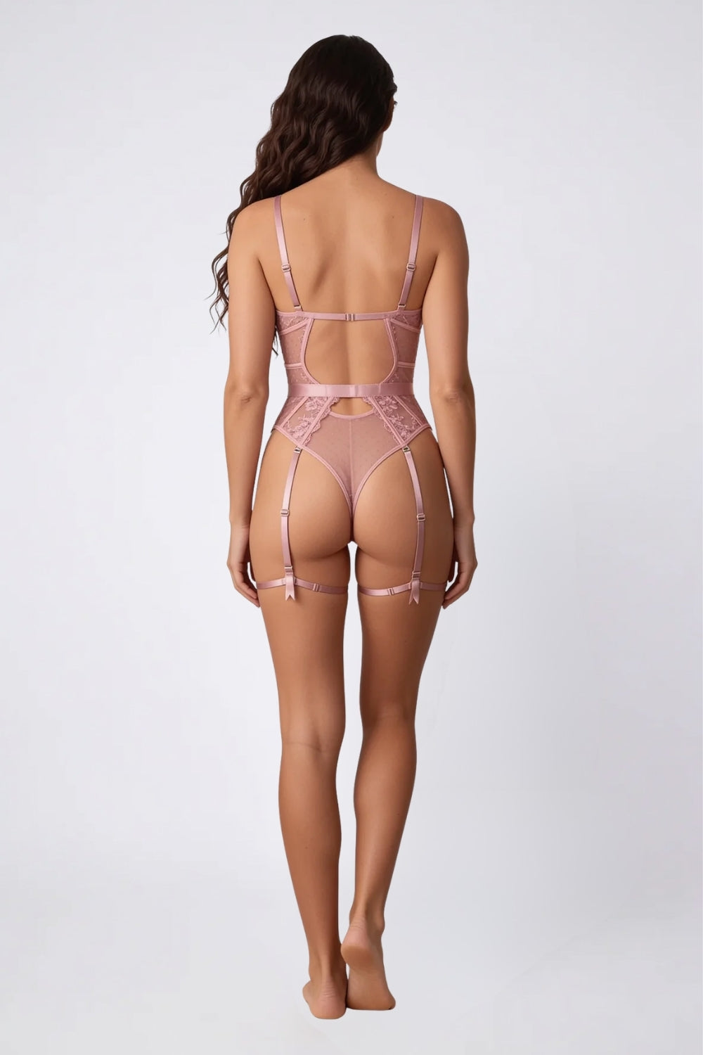 Model wearing floral lace garter detail bodysuit in light pink, alternate view