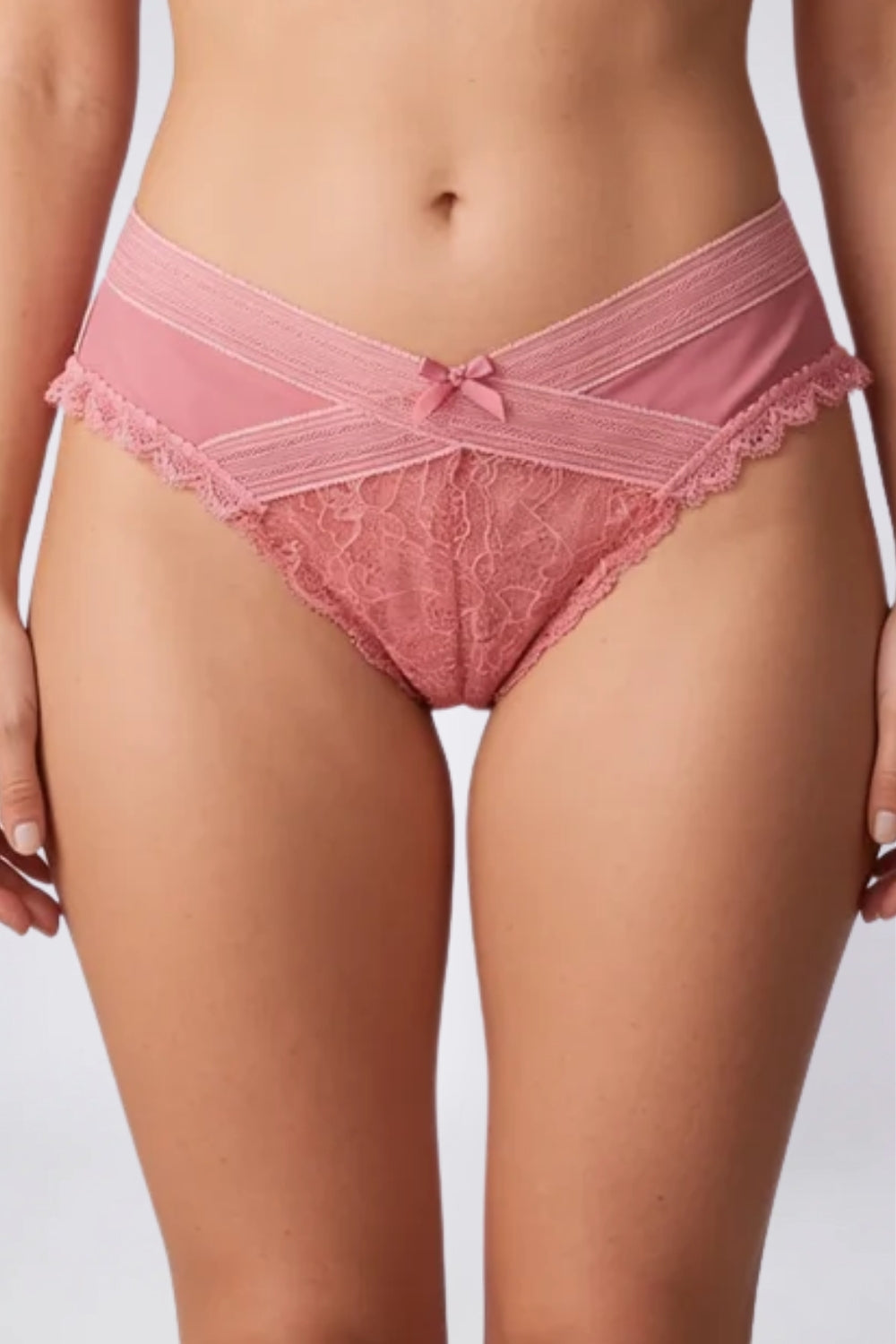 Model wearing floral lace crossover brief in pink