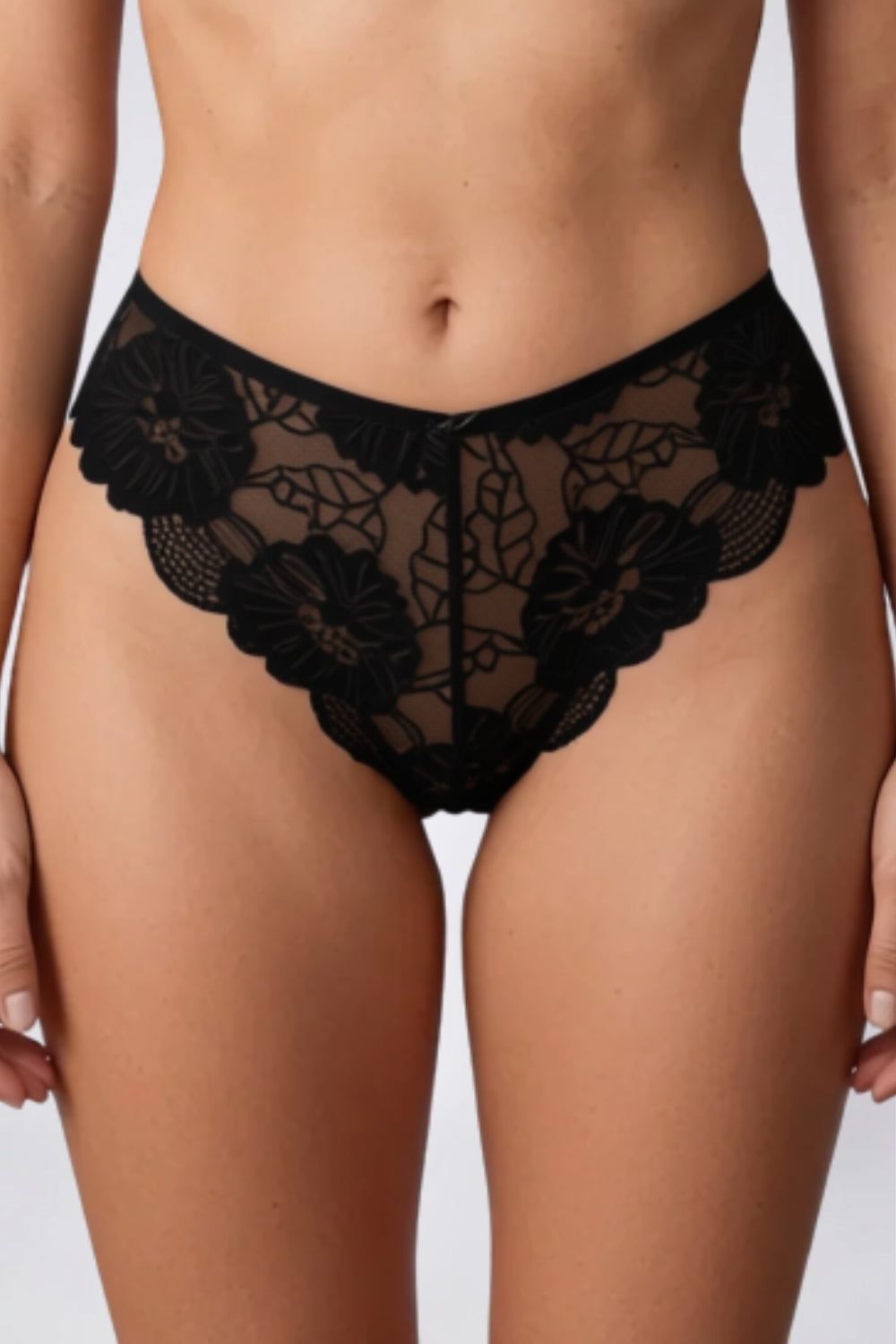 Model wearing floral lace sheer brief in black