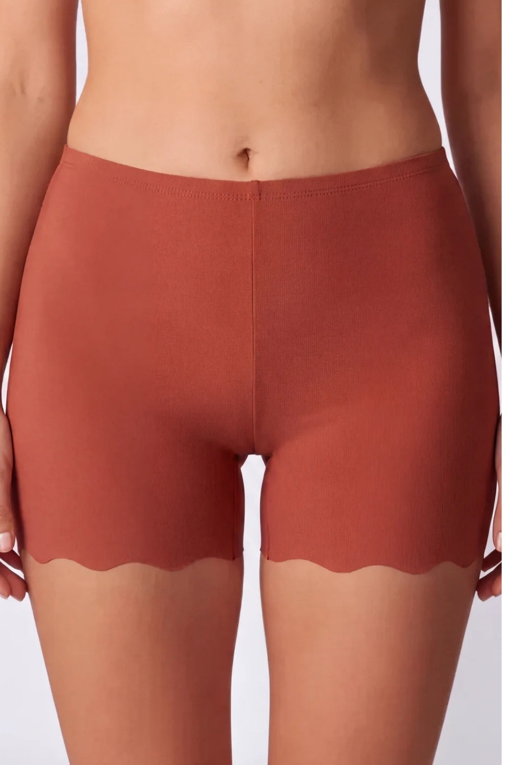 Model wearing laser-cut seamless boyshort in clay