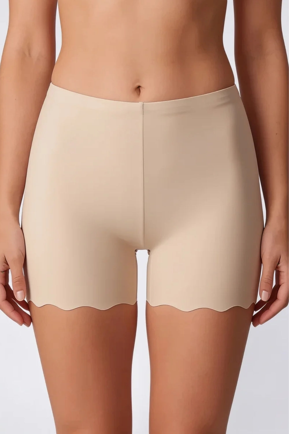 Model wearing laser-cut seamless boyshort in oat