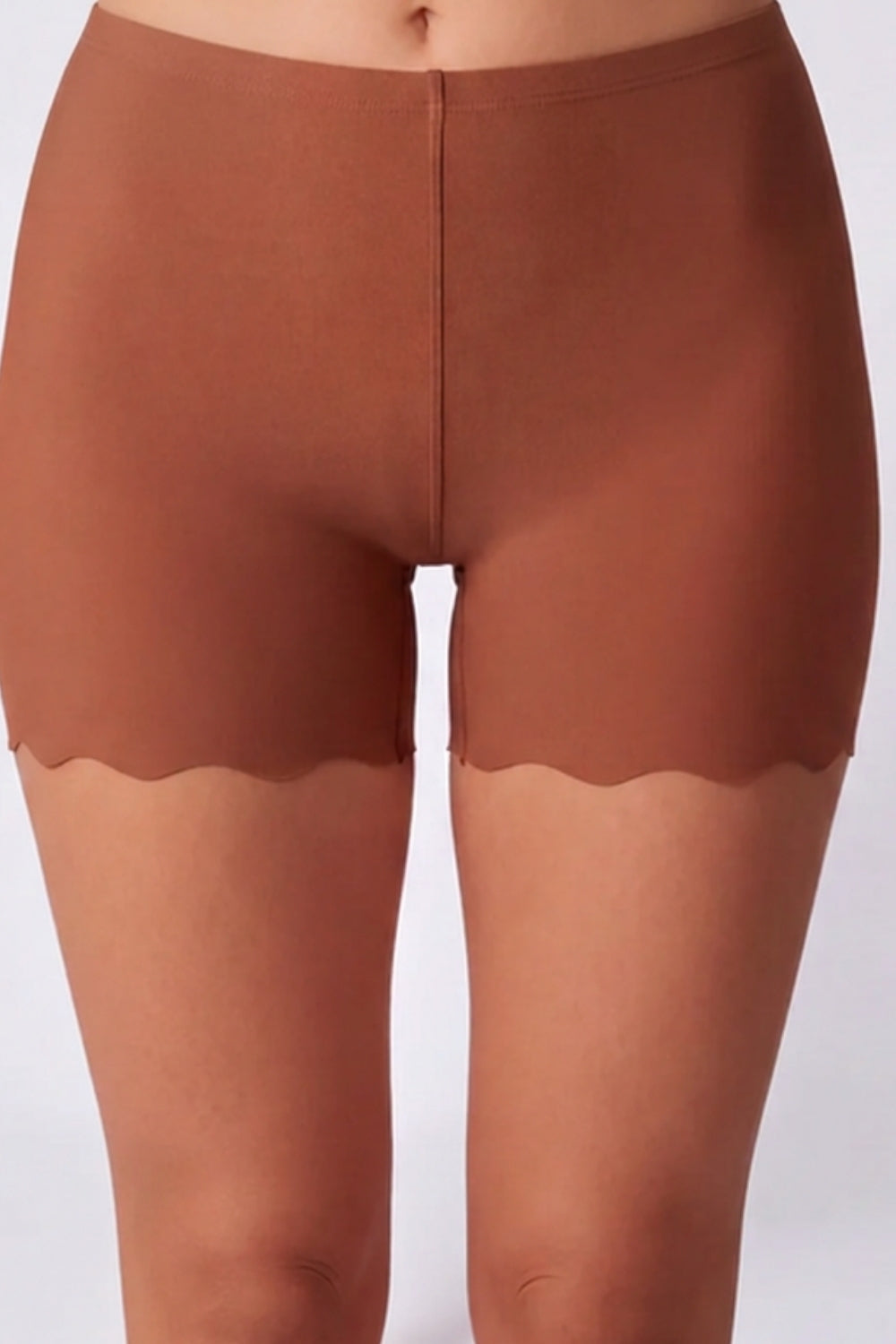 Model wearing laser-cut seamless boyshort in sienna