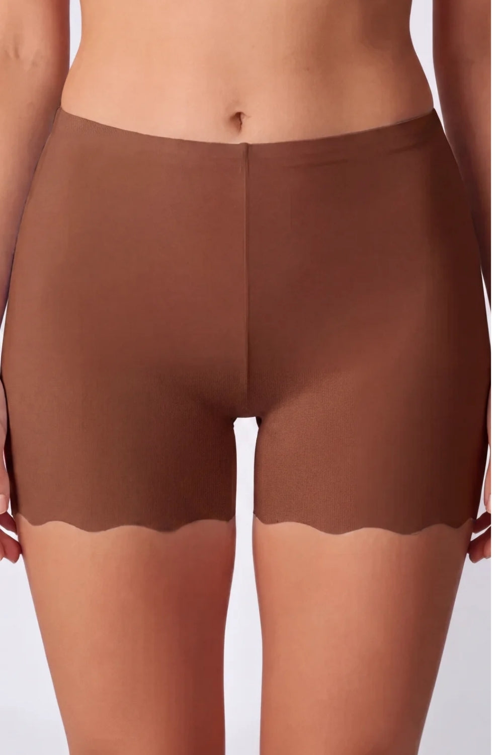 Model wearing laser-cut seamless boyshort in umber