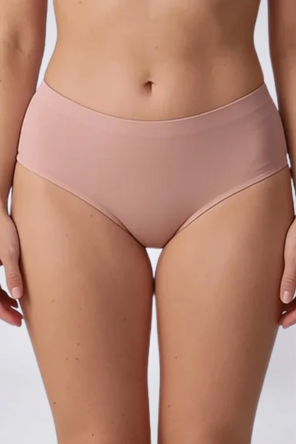 Model wearing laser-cut seamless brief in clay