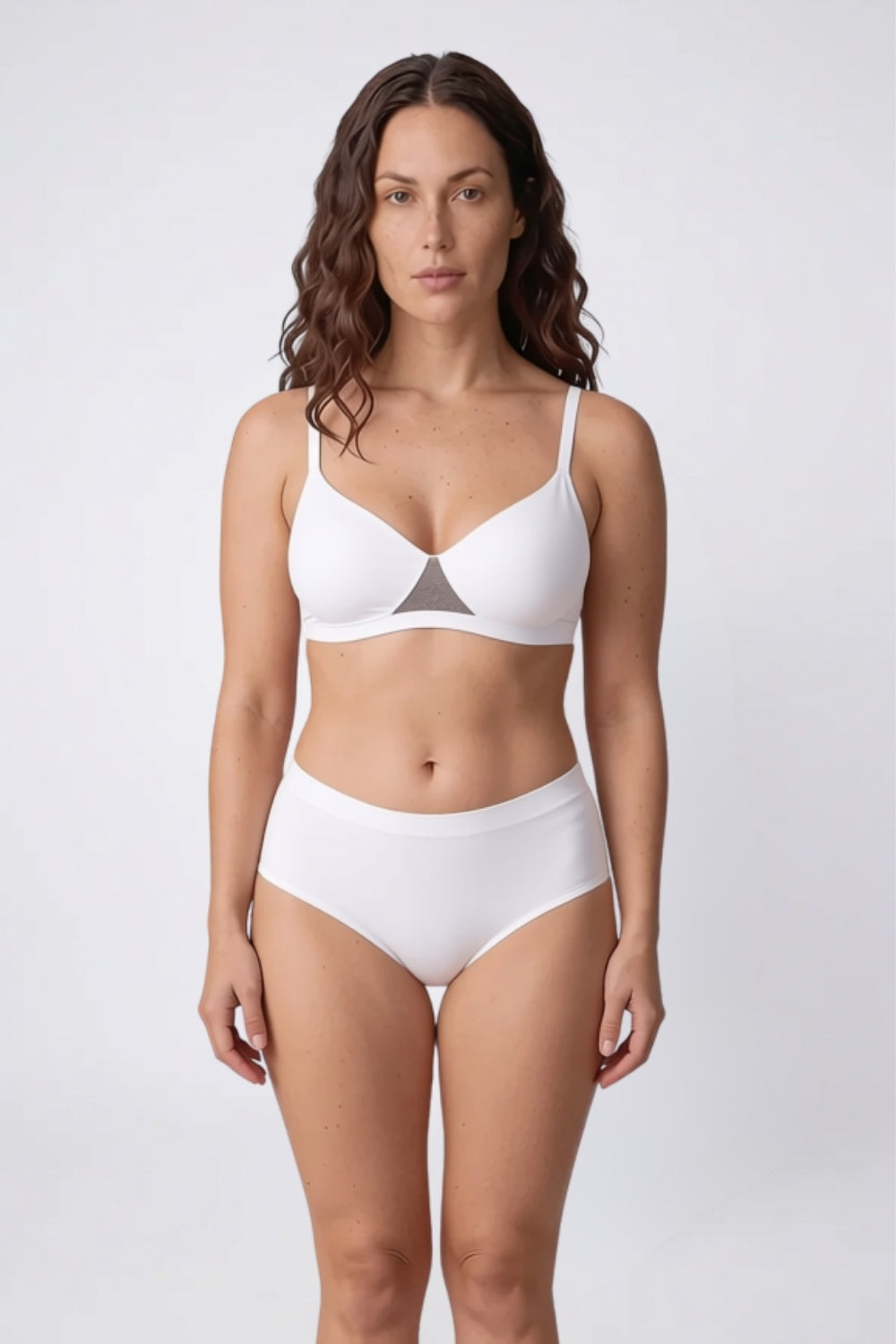 Model wearing laser-cut seamless brief in ivory, alternate view