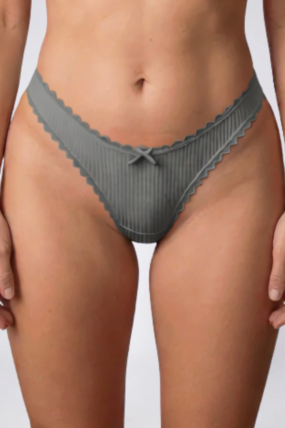 Model wearing ribbed lace trim thong in grey