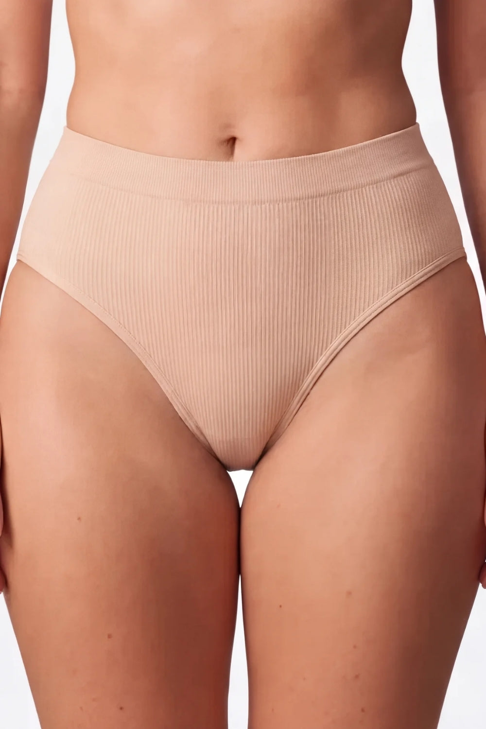 Model wearing ribbed seamless brief in almond
