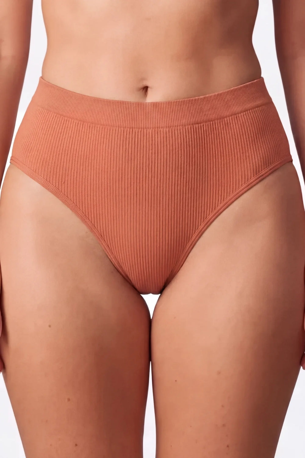 Model wearing ribbed seamless brief in clay