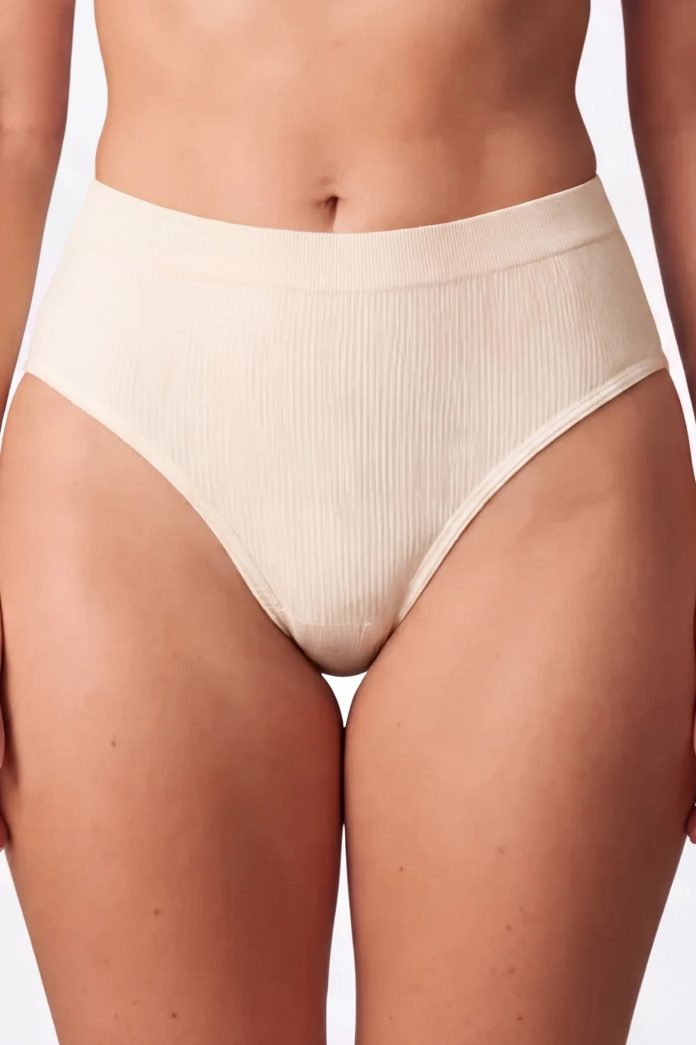 Model wearing ribbed seamless brief in sand