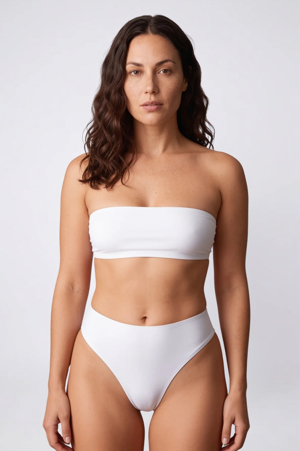 Model wearing seamless low rise thong in ivory, alternate view#Color_Ivory