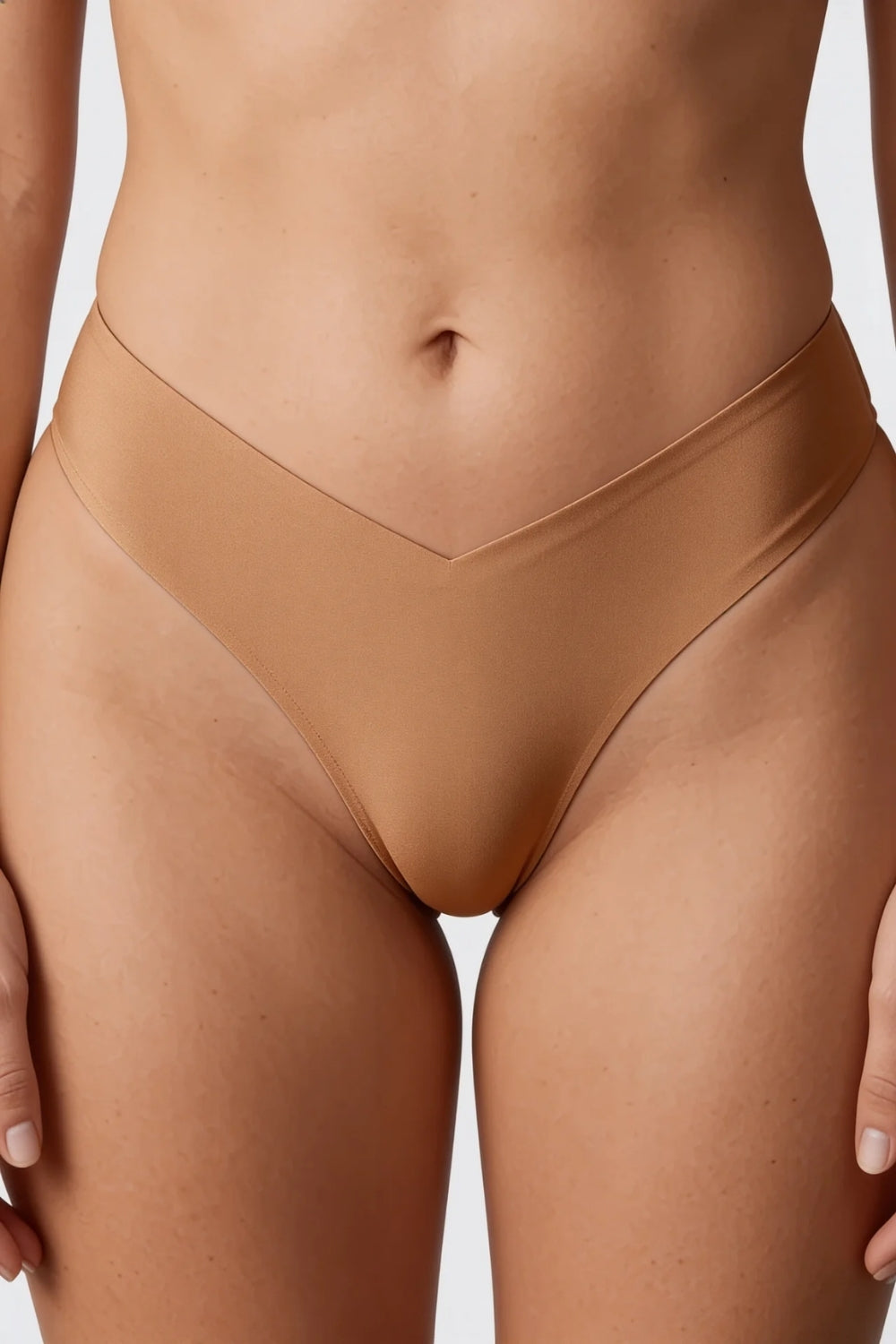 Model wearing silky seamless v waist brief in almond