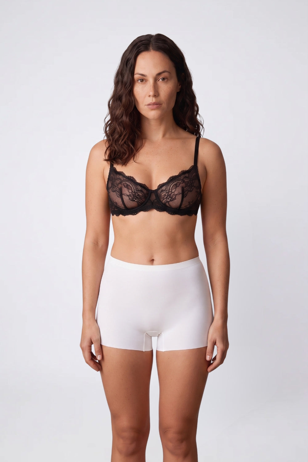 Model wearing smooth coverage seamless boy short mid-rise shorts in ivory, alternate view#Color_Ivory
