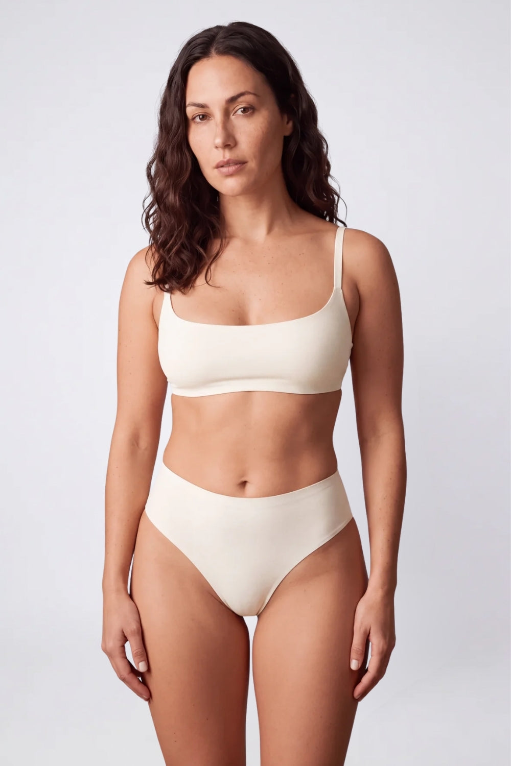Model wearing soft-edge seamless brief in ivory, alternate view#Color_Ivory