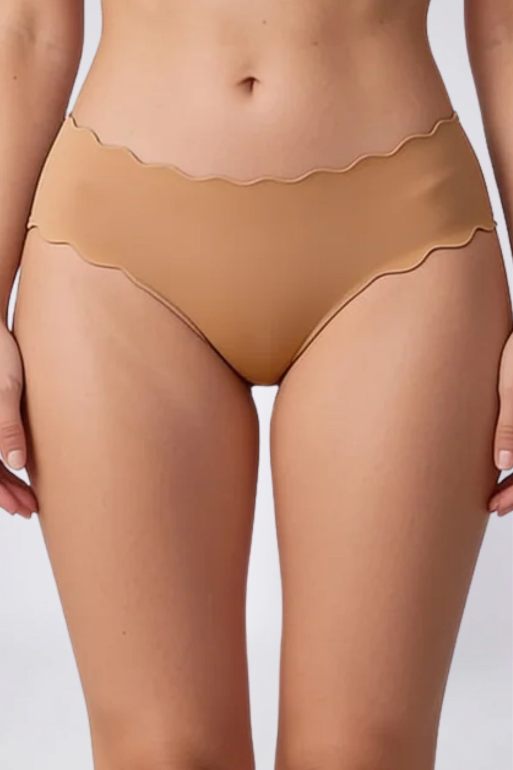 Model wearing wavy edge seamless brief in almond