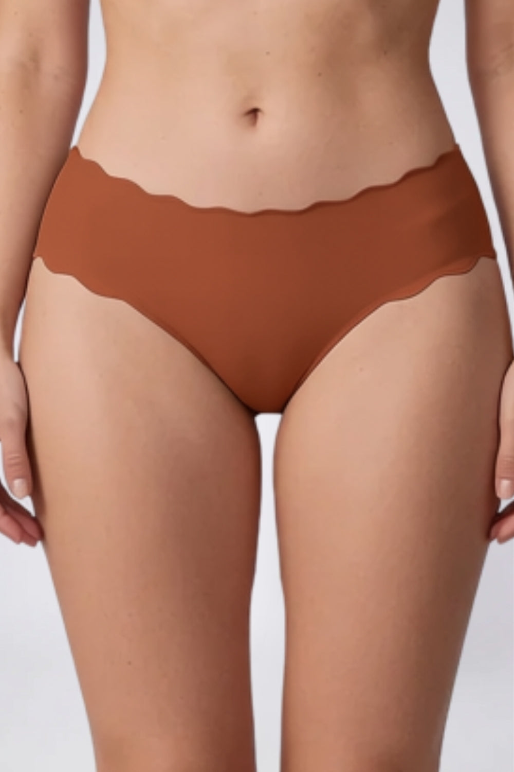 Model wearing wavy edge seamless brief in clay