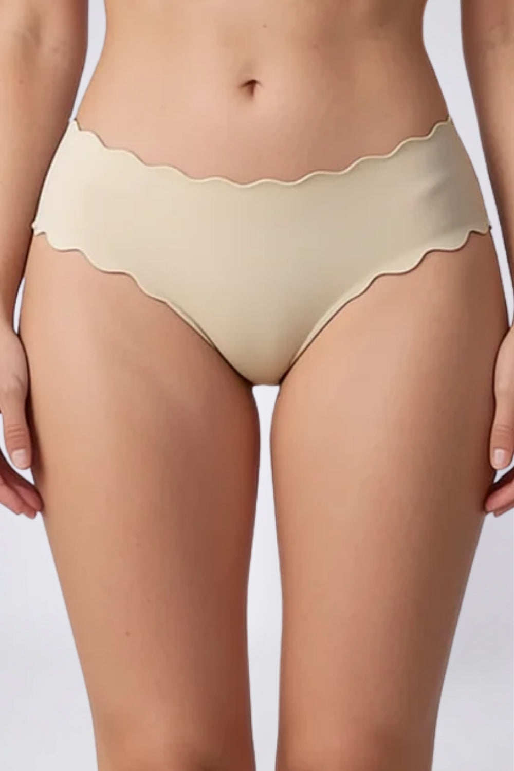 Model wearing wavy edge seamless brief in oat