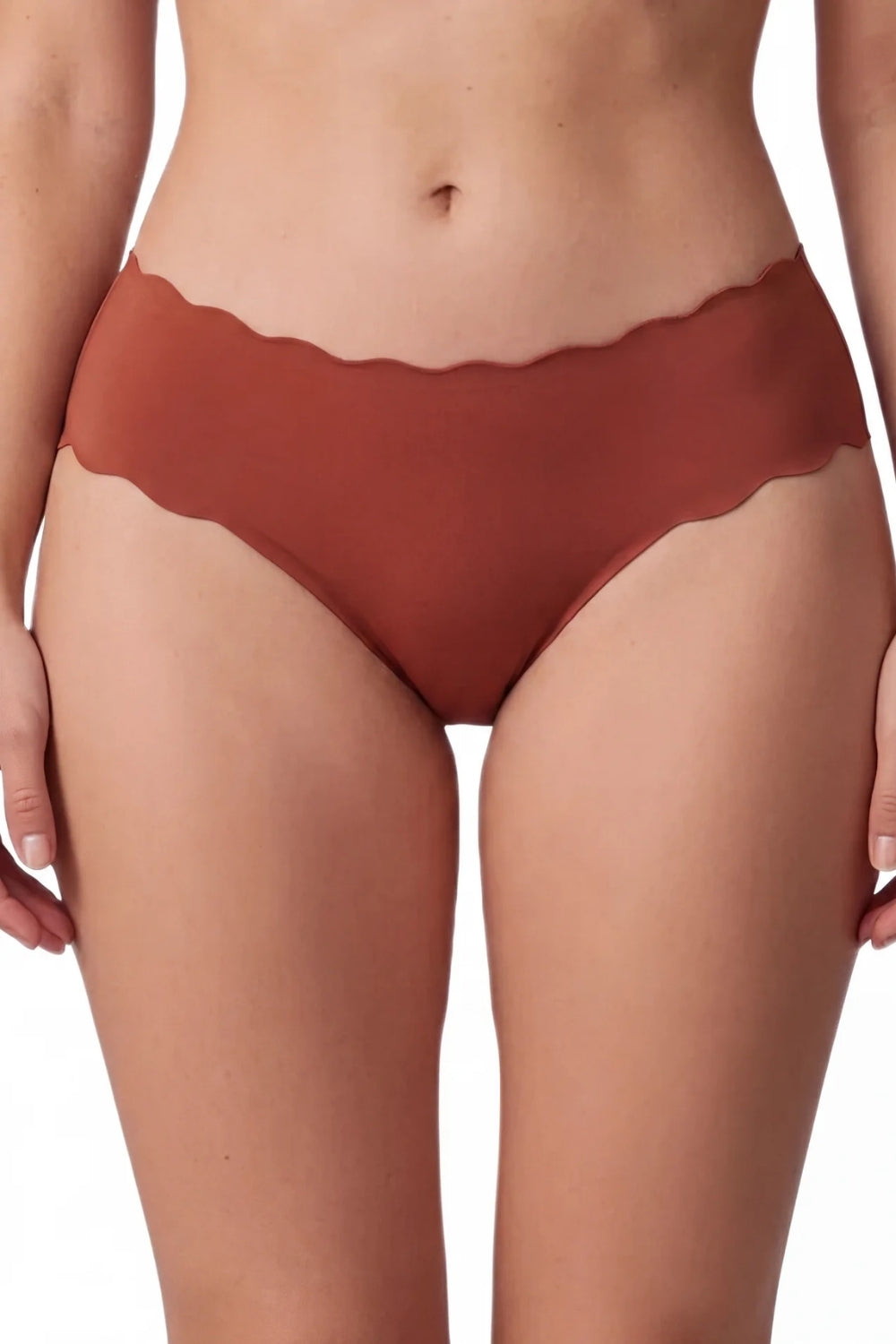 Model wearing wavy edge seamless brief in sienna