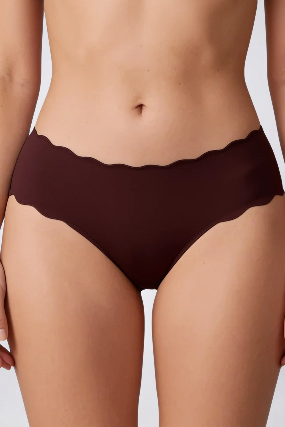 Model wearing wavy edge seamless brief in umber