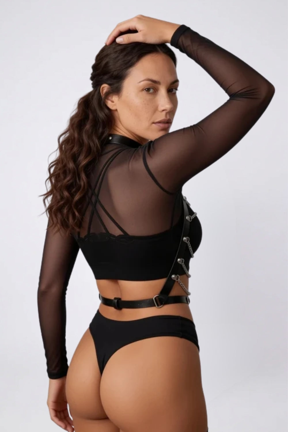 Model wearing layered chain choker chest harness in black, alternate view