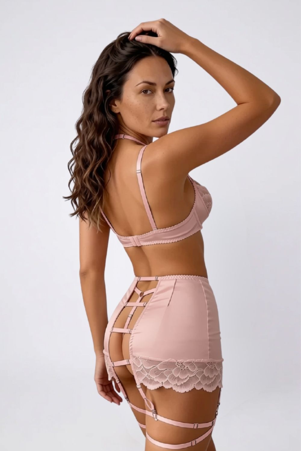 Model wearing satin lace garter three-piece lingerie set in pink, alternate view