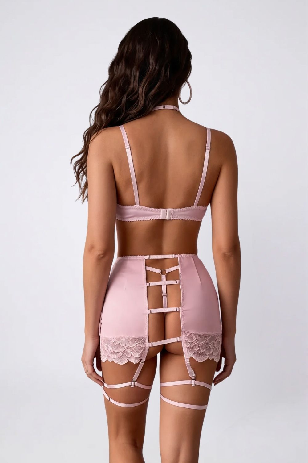 Model wearing satin lace garter three-piece lingerie set in pink, alternate view