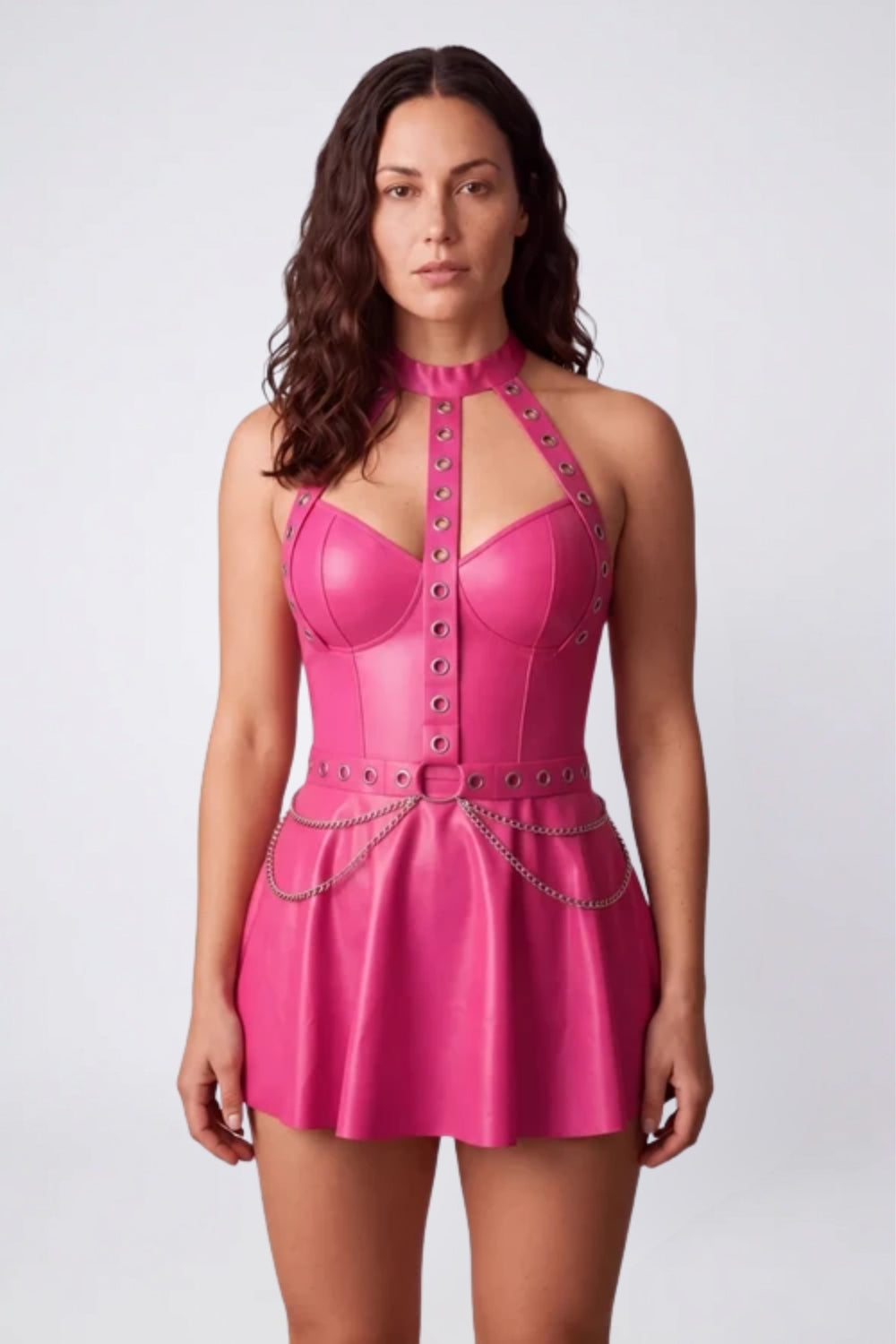 Model wearing grommet halter chain detail mini dress in pink