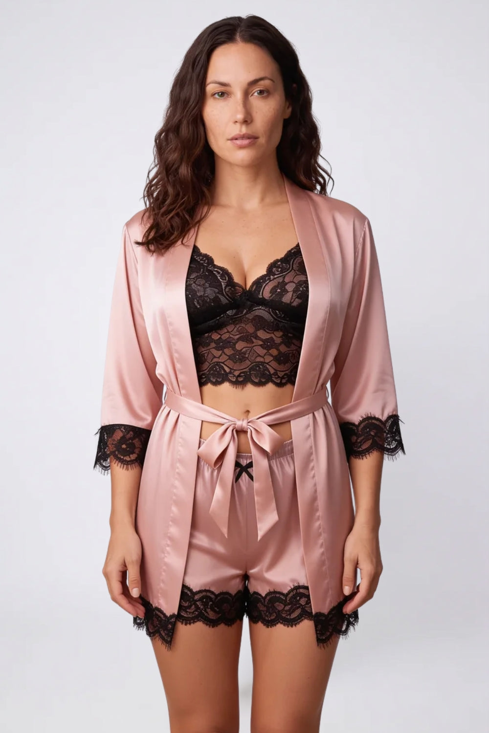 Model wearing satin lace trim lounge three-piece set in blush