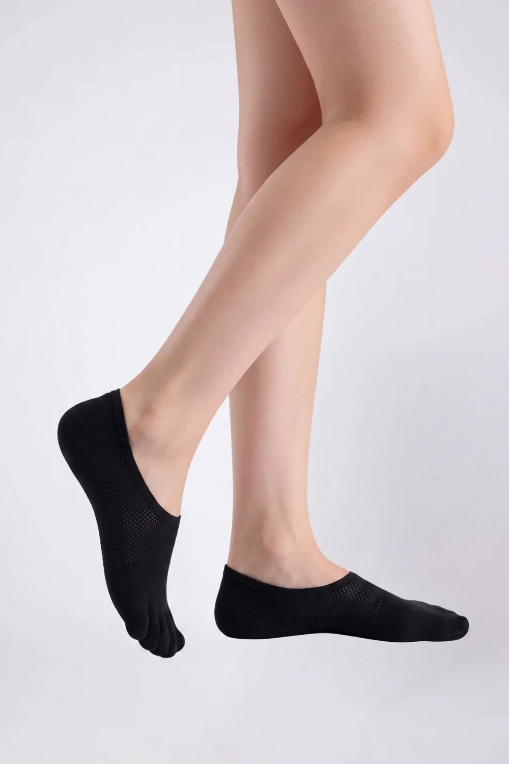 Model wearing five-toe no-show stockings in black, alternate view