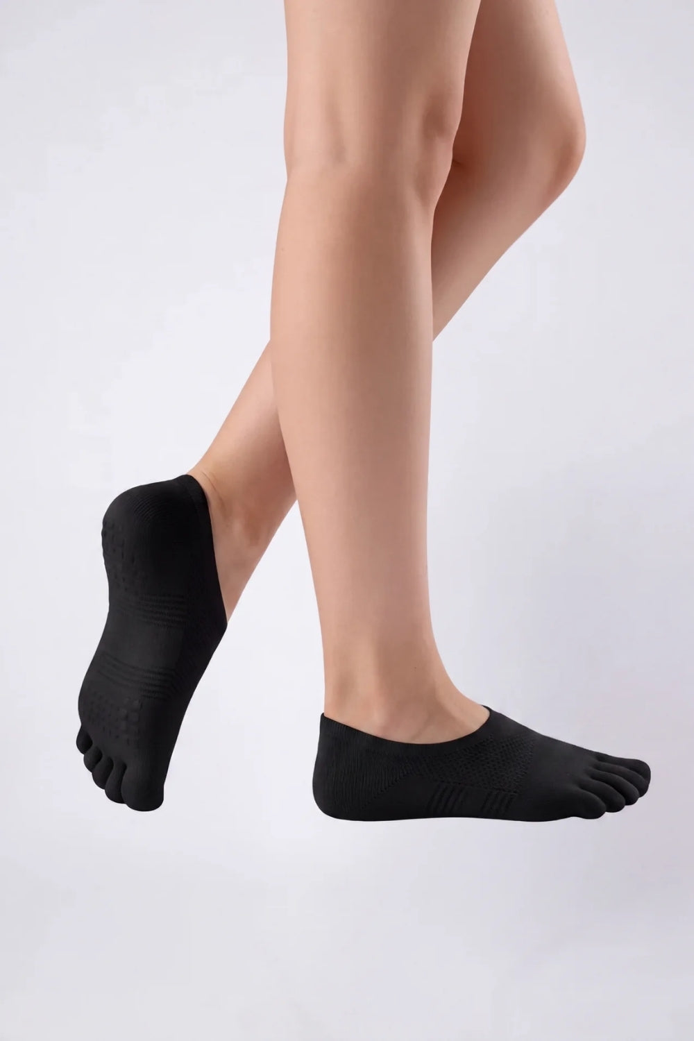 Model wearing five-toe no-show stockings in black, alternate view