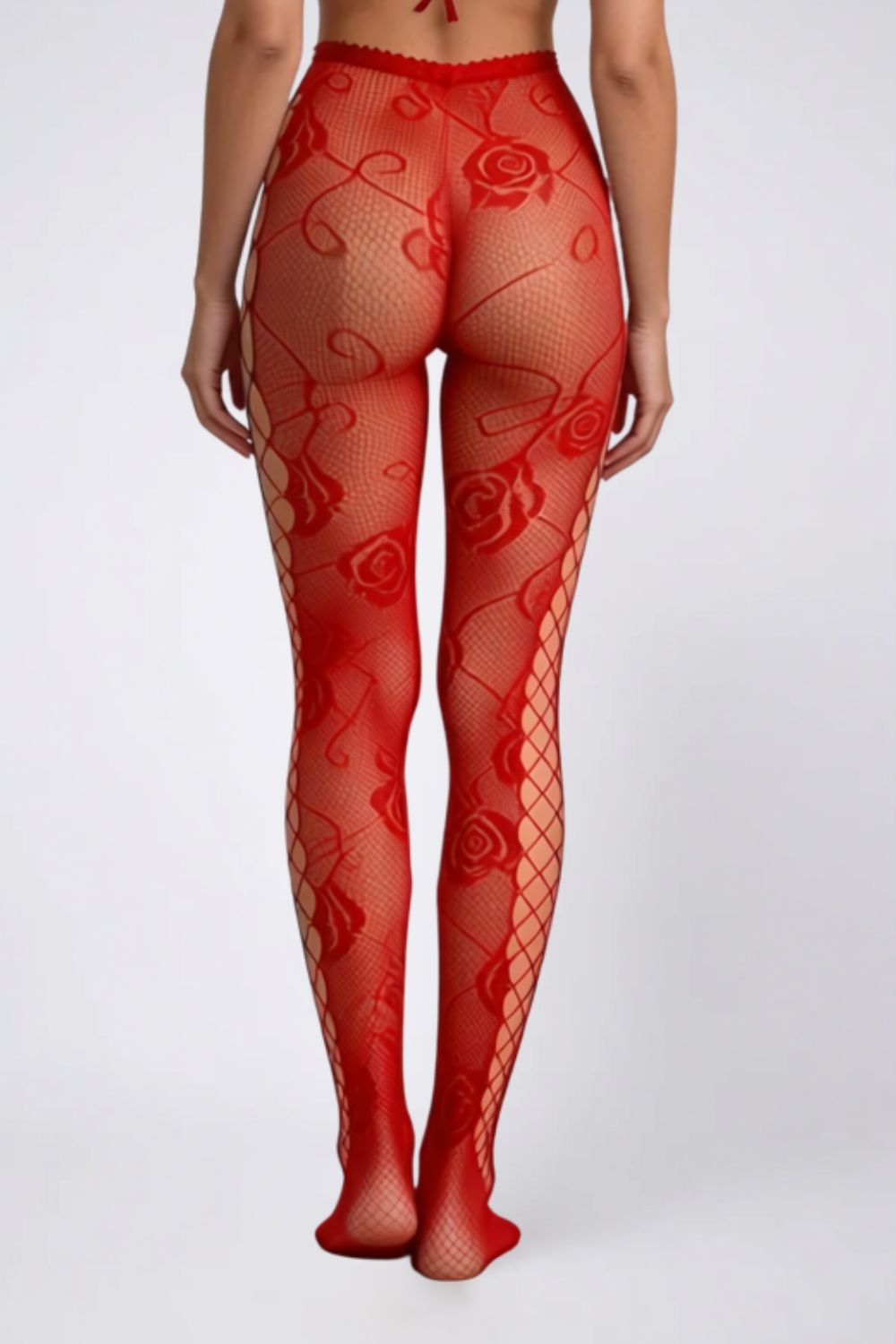 Model wearing floral fishnet with side cutouts tights in red, alternate view