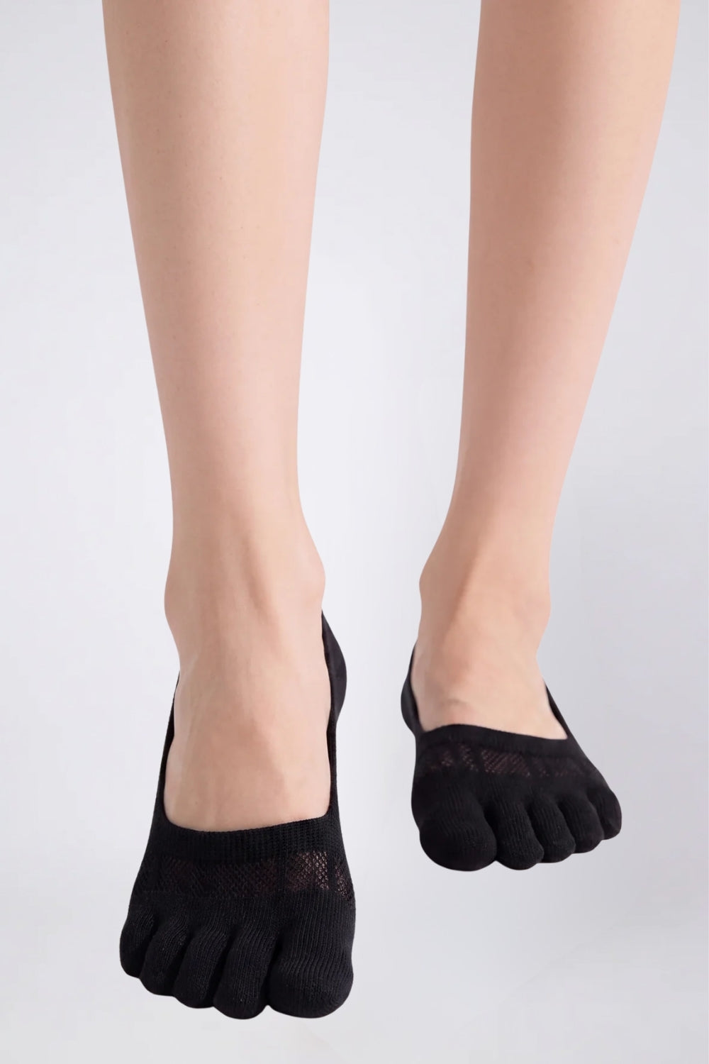Model wearing lyocell five-toe no-show stockings in black